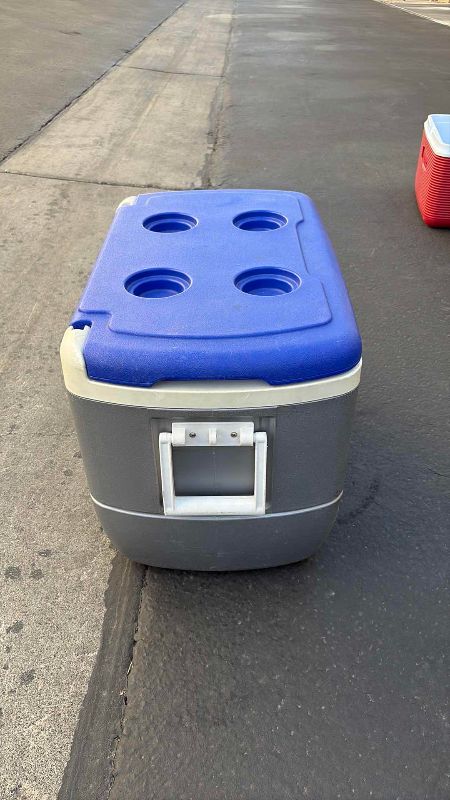 Photo 1 of IGLOO COOLER SILVER AND BLUE 26” X 15” X 16”