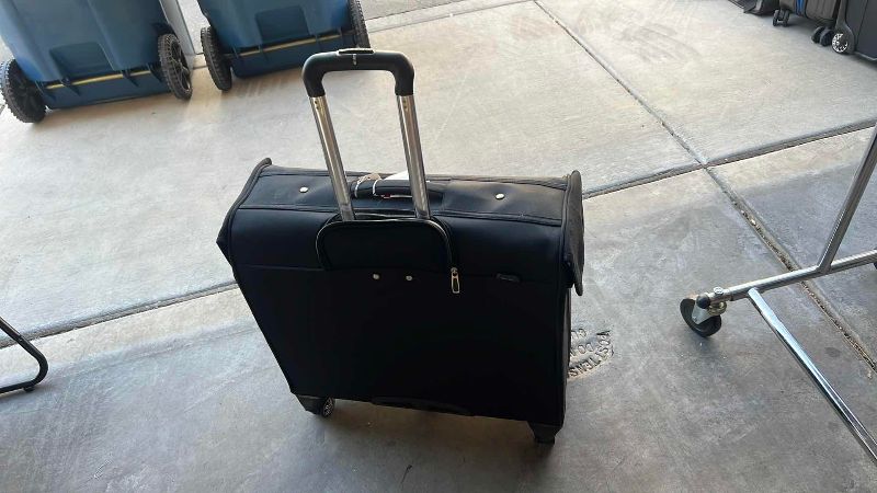 Photo 1 of BLACK DELSEY SUITCASE 23” X 9” H 20”