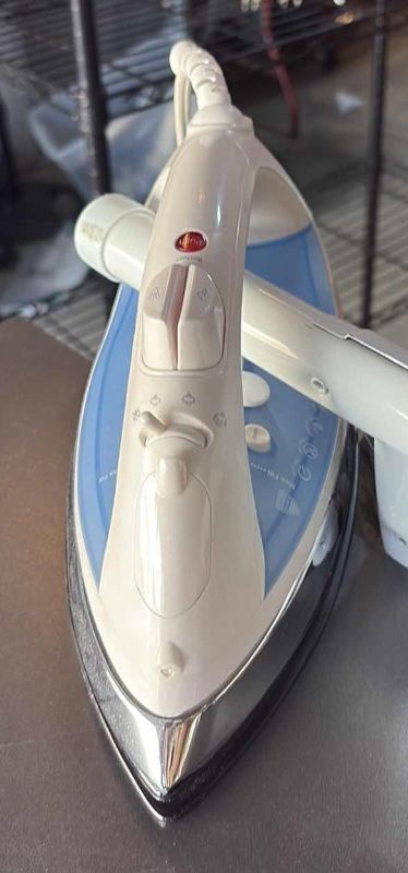 Photo 1 of IRONING BOARD, CLOTHES DRYING RACK  AND AN IRON