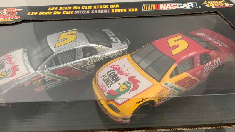 Photo 1 of NASCAR RACING CHAMPIONS 10TH ANNIVERSARY 1/64 SCALE TRANSPORTER WITH 164 AND ONE 24 SCALE STOCK CAR TERRY LABONTE NUMBER 5