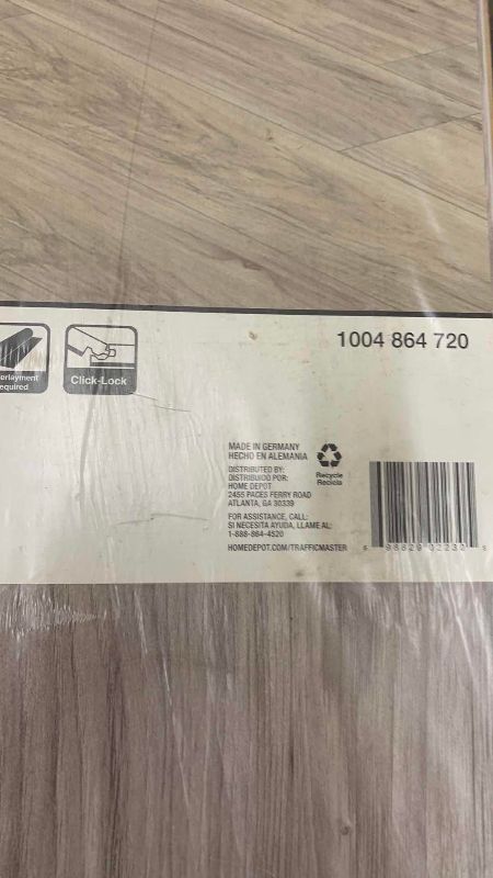 Photo 1 of TRAFFIC MASTER LAMINATE FLOORING LAKESHORE PECAN STONE 24.17 SQ FT PER BOX 9 PIECES PER BOX