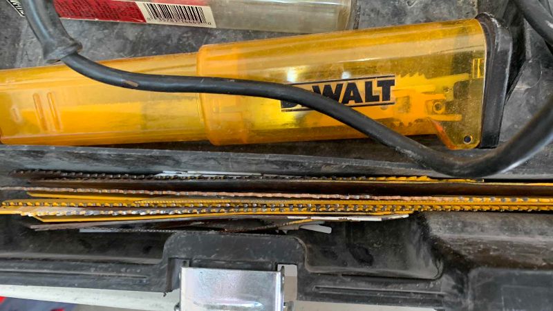 Photo 1 of DEWALT SAWZALL DW303 WITH BLADES