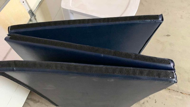 Photo 1 of PLASTIC STORAGE AND AN EXERCISE MAT