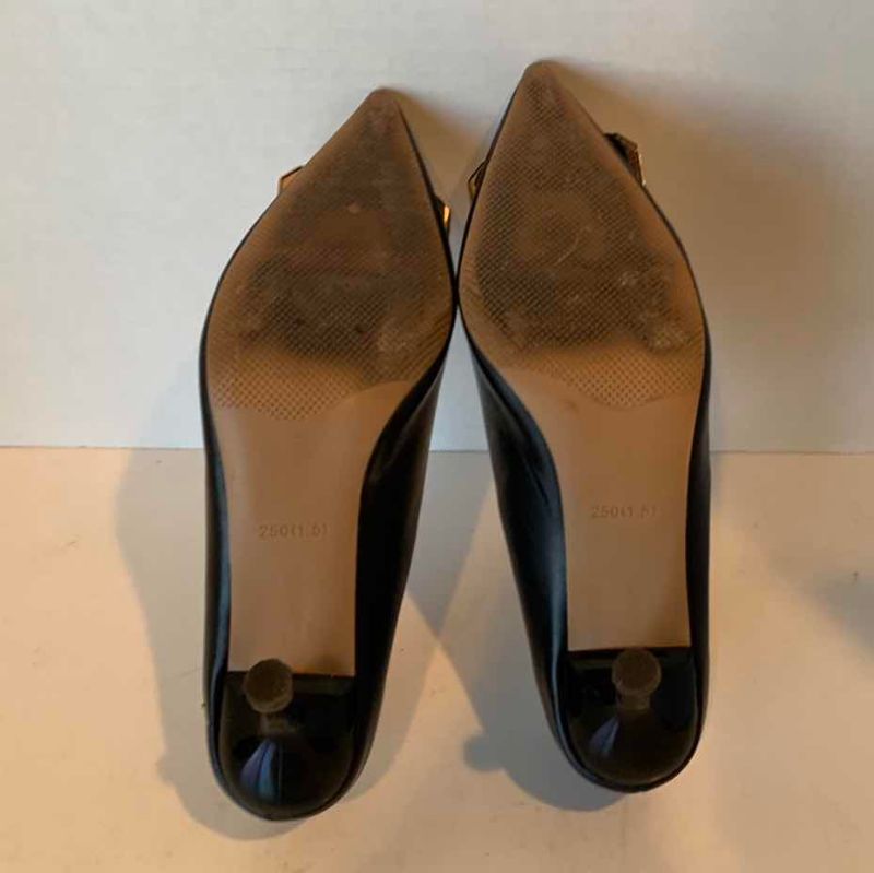 Photo 1 of BLACK PUMP WITH GOLD “G” EMBLEMS SIZE NOT FOUND