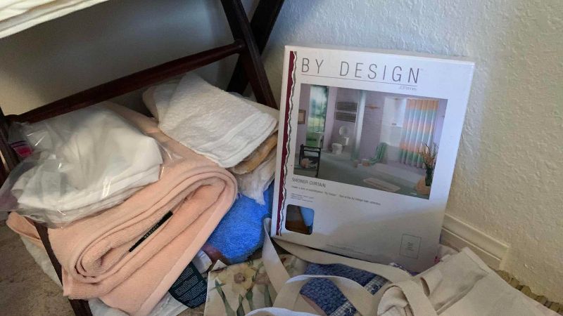 Photo 1 of LINENS AND VINTAGE SUITCASE RACK
