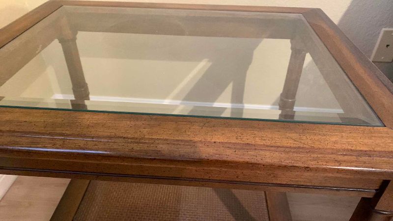Photo 1 of VINTAGE BEVELED GLASS WOOD AND WICKER END TABLE 27” X 21” H 21”