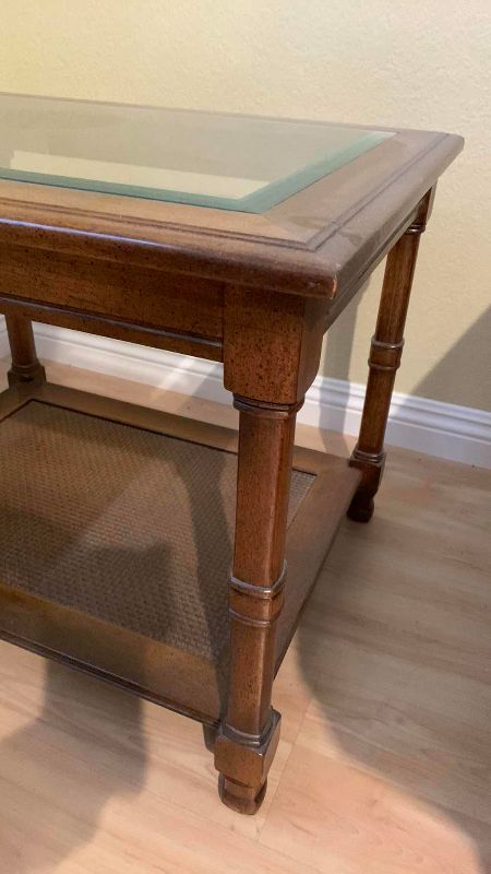 Photo 1 of VINTAGE BEVELED GLASS WOOD AND WICKER END TABLE 27” X 21” H 21”