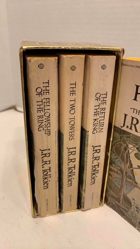 Photo 1 of VINTAGE J.R.R TOLKIEN GOLD FOIL LORD OF THE RINGS TRILOGY BOX SET PLUS THE HOBBIT BOOK