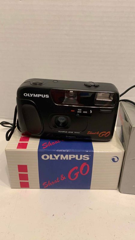 Photo 1 of CANON SNAPPY S AND OLYMPUS SHOOT AND GO CAMERAS