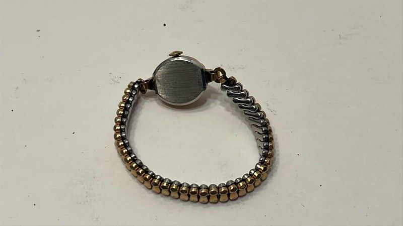 Photo 1 of VINTAGE WITTNAUER GOLD TONE AND STAINLESS STEEL WATCH