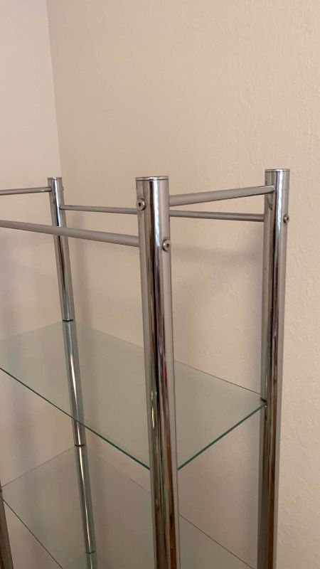Photo 1 of GLASS AND METAL SHELF UNIT 25” X 11” H 63”