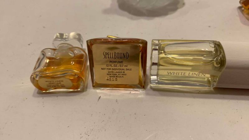 Photo 1 of 4-PERFUME SAMPLES AND A DECANTER