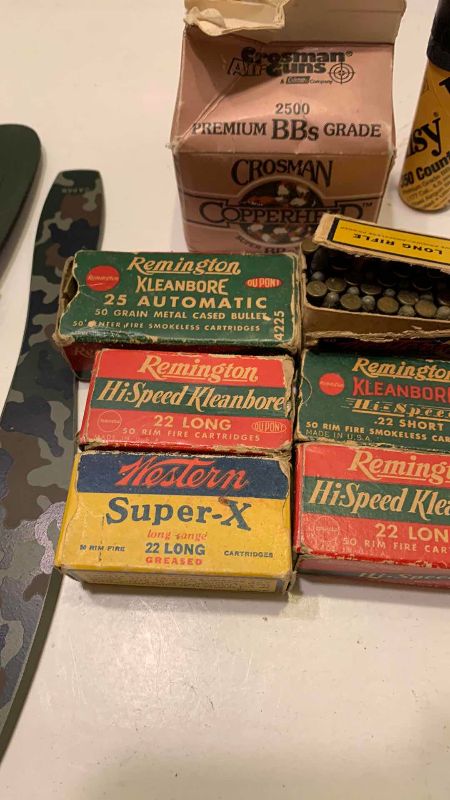 Photo 1 of VINTAGE .22 AND .25 AMMUNITION, BB’S AND A CAMO THROWING KNIFE