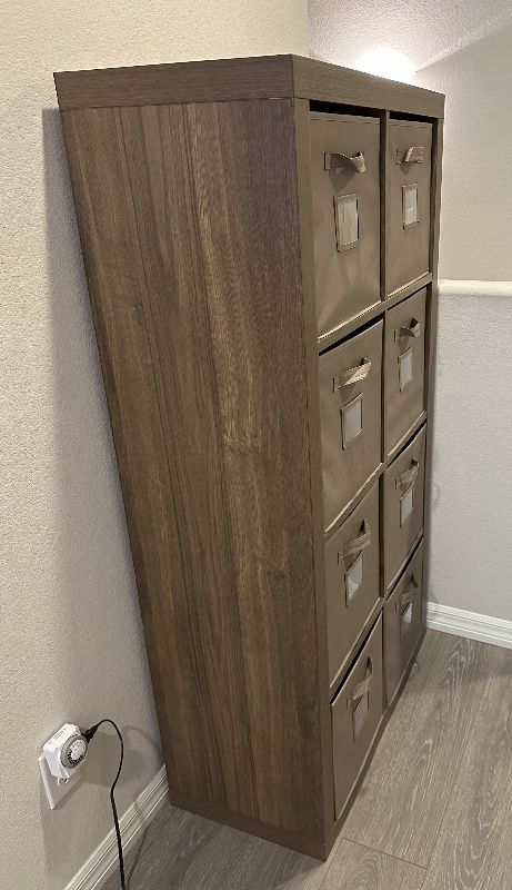 Photo 1 of WOODEN SHELVING UNIT WITH CLOTH DRAWER BASKETS 31” X 16” H 59”