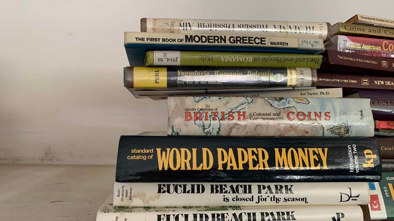 Photo 1 of ASSORTED COIN AND GEOGRAPHY BOOKS