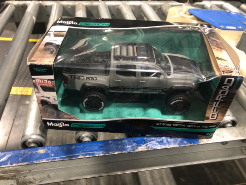 Photo 1 of 1:24 Scale Diecast Model Car Compatible with Maisto Toyota Tacoma TRD Off Road Pickup Truck Cement Grey 32458