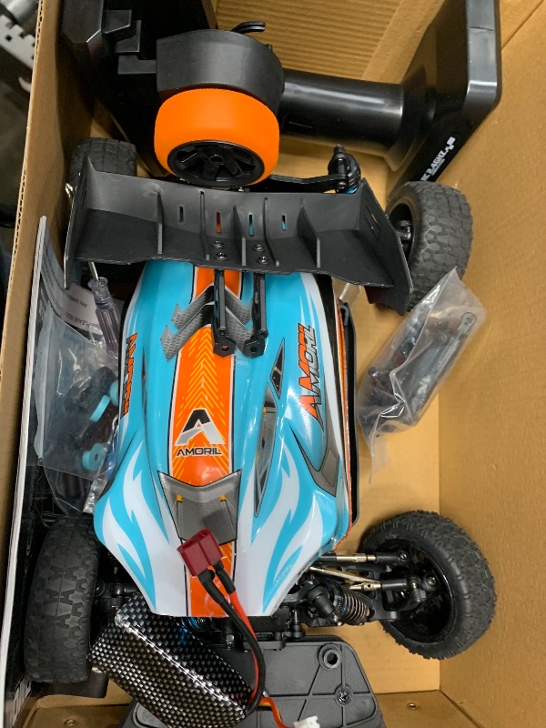 Photo 1 of AMORIL 1:14 Fast RC Cars for Adults,Max 70+KMH Hobby Remote Control Car,4X4 Monster Truck Racing Buggy,Electric Vehicle Toy for Kids with Oil Shocks,Metal Parts