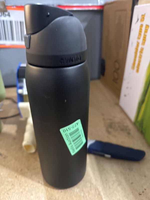 Photo 1 of Owala FreeSip Insulated Stainless Steel Water Bottle with Straw for Sports, Travel, and School BPA-Free Sports Water Bottle, 40 oz, Very, Very Dark
