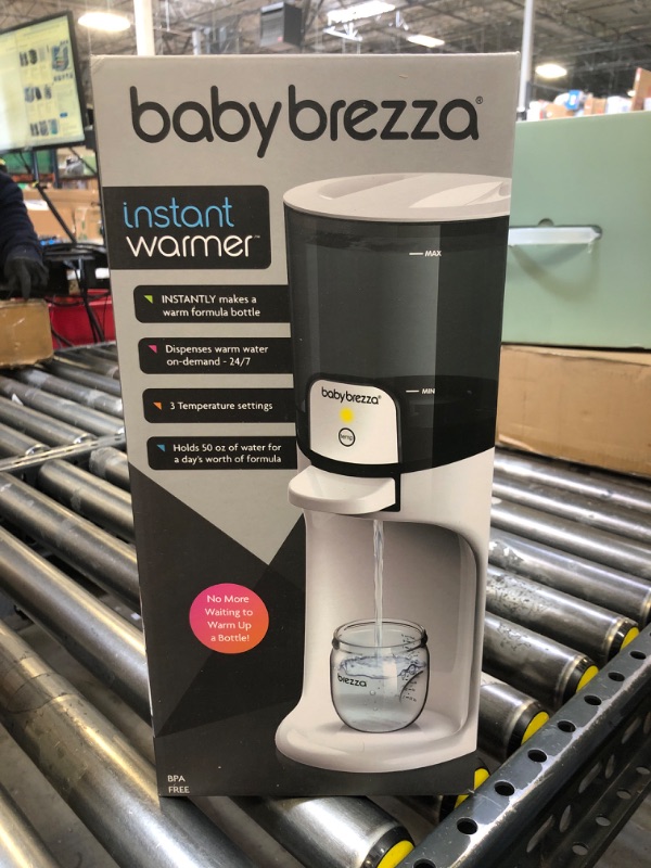Photo 1 of Baby Brezza New and Improved Formula Pro Advanced Formula Dispenser Machine - Automatically Mix a Warm Formula Bottle Instantly - Easily Make Bottle with Automatic Powder Blending, White