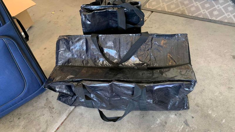 Photo 1 of 2-CLOTHSIDE AMERICAN TOURISTER SUITCASES AND 2-LARGE STORAGE BAGS