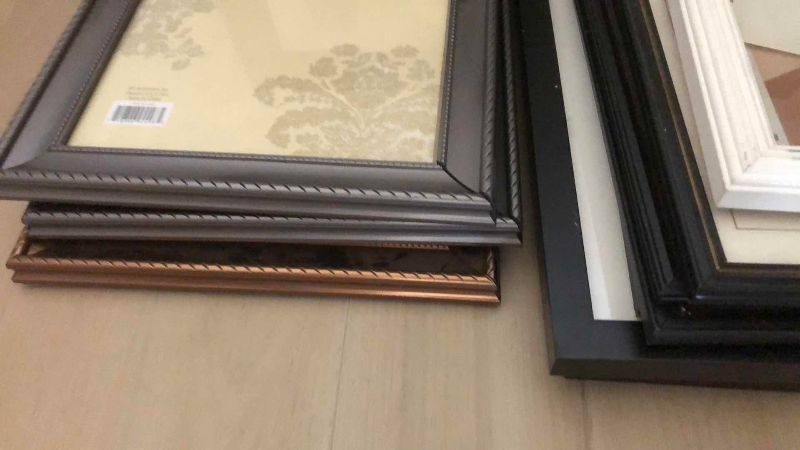 Photo 1 of ASSORTED SIZES AND TYPES OF PICTURE FRAMES