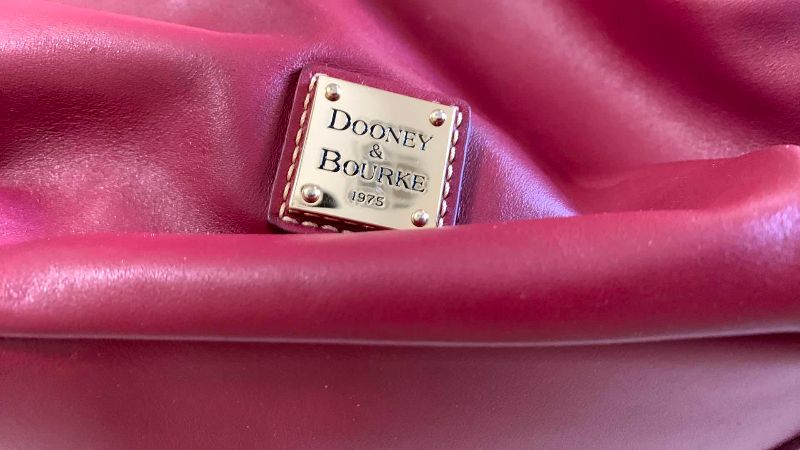 Photo 1 of DOONEY AND BOURKE HANDBAG AND COIN PURSE