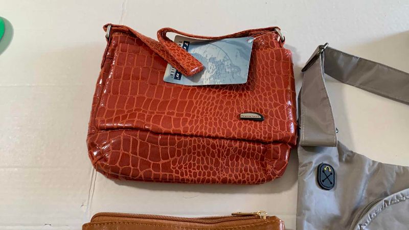 Photo 1 of THREE TRAVEL HANDBAGS