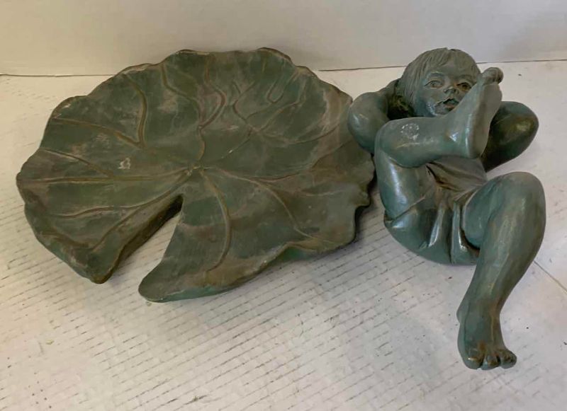 View 3 of RESIN BOY RESTING ON LILLY PAD 10 1/2” x 7”