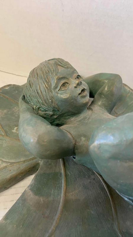 View 2 of RESIN BOY RESTING ON LILLY PAD 10 1/2” x 7”