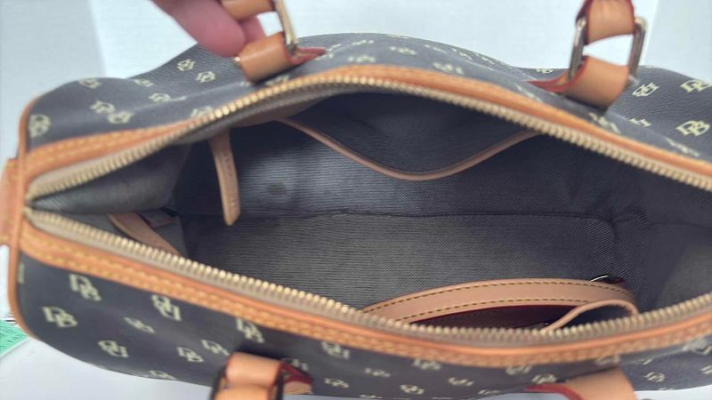 Photo 1 of DOONEY & BOURKE BLACK AND BROWN SATCHEL 12”X12”