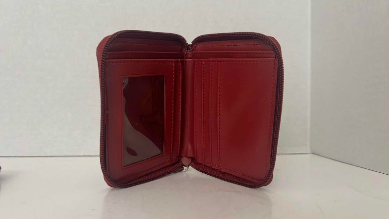 Photo 1 of BURGUNDY PEBBLE CLUTCH AND WALLET KENNETH COLE REACTION 8.5” X 5”