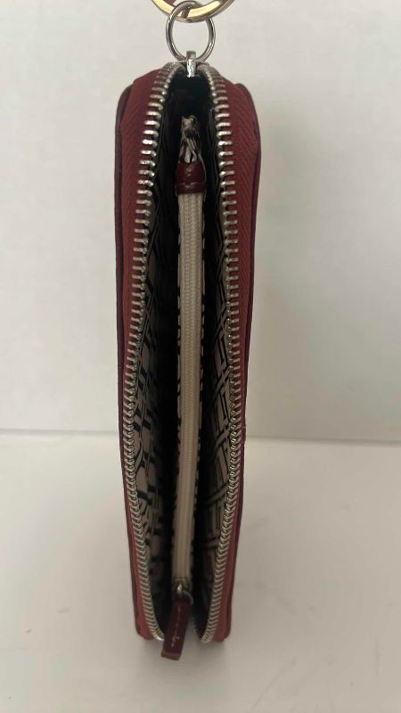 Photo 1 of BURGUNDY PEBBLE CLUTCH AND WALLET KENNETH COLE REACTION 8.5” X 5”