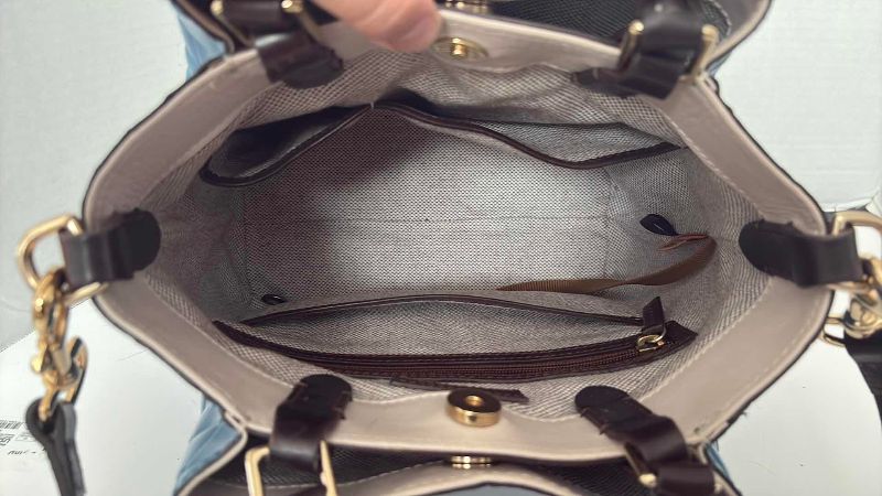 Photo 1 of DOONEY AND BOURKE BLUE BARLOW HANDBAG 12”X12”