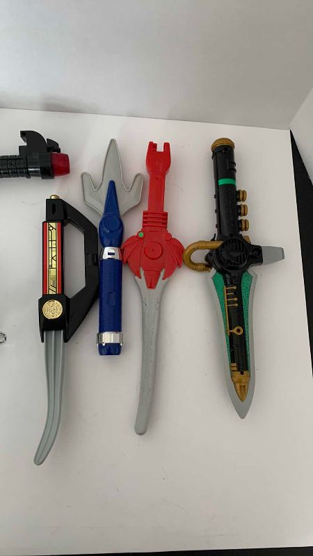 Photo 1 of VINTAGE MIGHTY MORPHIN POWER RANGERS GUNS AND KNIVES