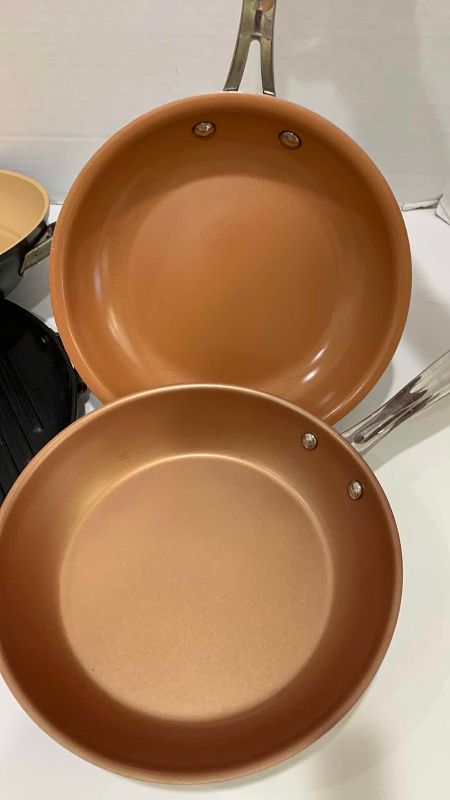 Photo 1 of 3- COPPER TYPE FRYING PANS AND A GRIDDLE