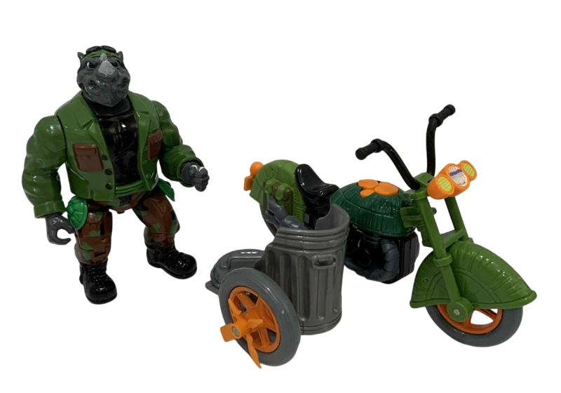 Photo 1 of VINTAGE TEENAGE MUTANT NINJA TURTLES MUTATIN ROCKSTEADY ACTION FIGURE AND A TURTLECYCLE
