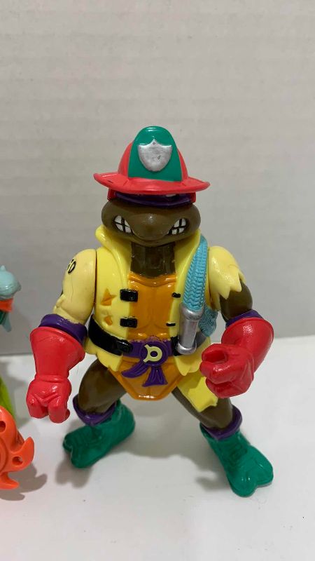 Photo 1 of VINTAGE TEENAGE MUTANT NINJA TURTLES SLAM DUNKIN DONATELLO, MIKE THE SURFER AND HOSE’EM DOWN DONATELLO ACTION FIGURES