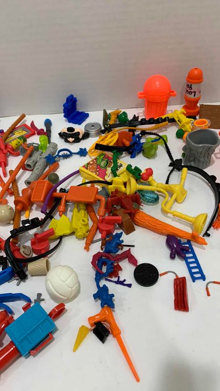 Photo 1 of VINTAGE TEENAGE MUTANT NINJA TURTLES ASSORTED WEAPONS AND GEAR