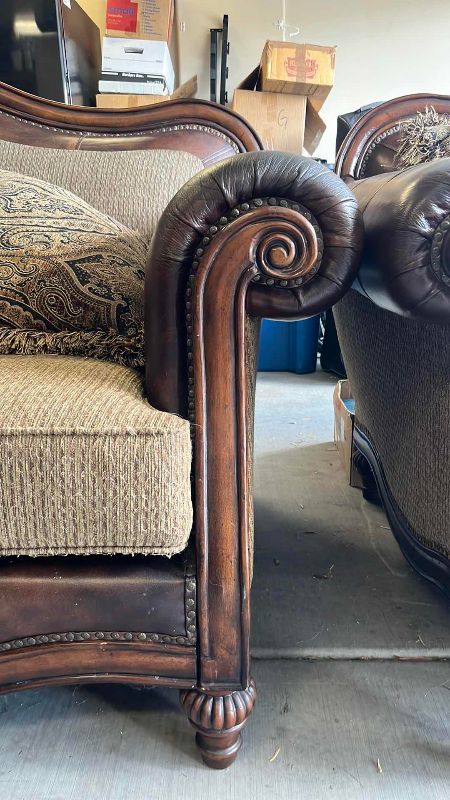 View 2 of ASHLEY FURNITURE FRESCO SOFA WITH LEATHER ARMRESTS AND NAIL HEAD TRIM 90” X 40” H 45”