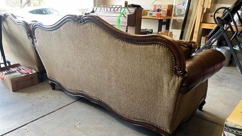 View 5 of ASHLEY FURNITURE FRESCO SOFA WITH LEATHER ARMRESTS AND NAIL HEAD TRIM 90” X 40” H 45”