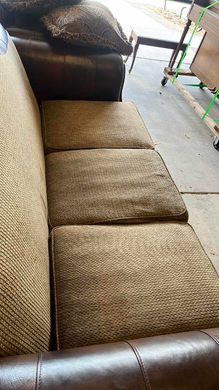 View 3 of ASHLEY FURNITURE FRESCO SOFA WITH LEATHER ARMRESTS AND NAIL HEAD TRIM 90” X 40” H 45”