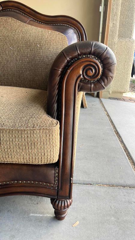 View 5 of BUTTON TUFTED LOVE SEAT WITH LEATHER ARMRESTS AND NAIL HEAD TRIM 68” X 41” H 44”