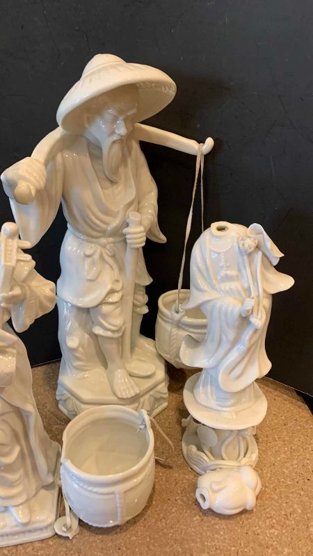 View 3 of VINTAGE WHITE PORCELAIN ASIAN WATER CARRIER AND MUSICIAN FIGURINES TALLEST 13 INCHES