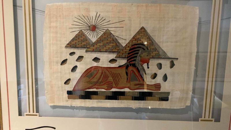View 2 of HAND PAINTED EGYPTIAN PAPYRUS ARTWORK WITH A SPHINX PYRAMIDS AND SUNBURST 43” X 36”