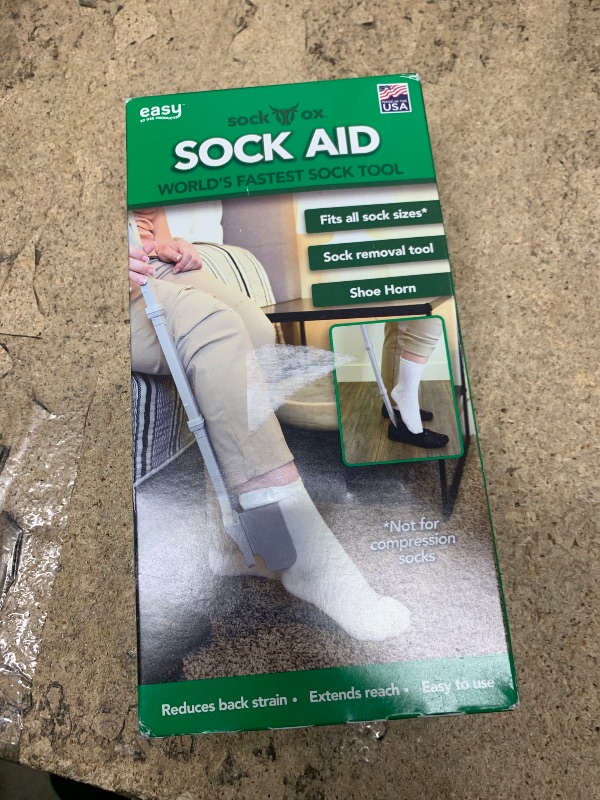 Photo 1 of Sock Ox by Easy To Use Products, adjustable sock aid device for seniors, not for compression socks, travel-friendly for elderly with built-in shoe horn, up to 36 inches in length