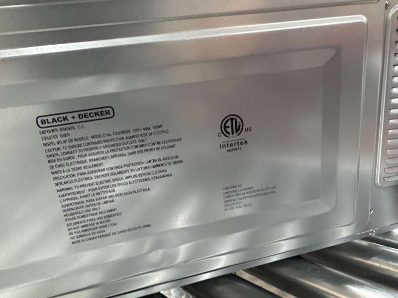 Photo 1 of *POWERS ON*BLACK+DECKER 8-Slice Extra Wide Convection Toaster Oven, Fits 9"x13" Oven Pans and 12" Pizza, Bake, Toast, Broil, and Keep Warm Functions, Countertop Compact Design with Stainless Steel Finish