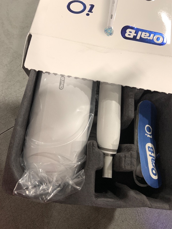 Photo 1 of Oral-B iO Deep Clean + Protect Rechargeable Electric Toothbrush, White with a iO Series 7 Toothbrush, 2 Replacement Brush Heads, and a Charging Travel Case