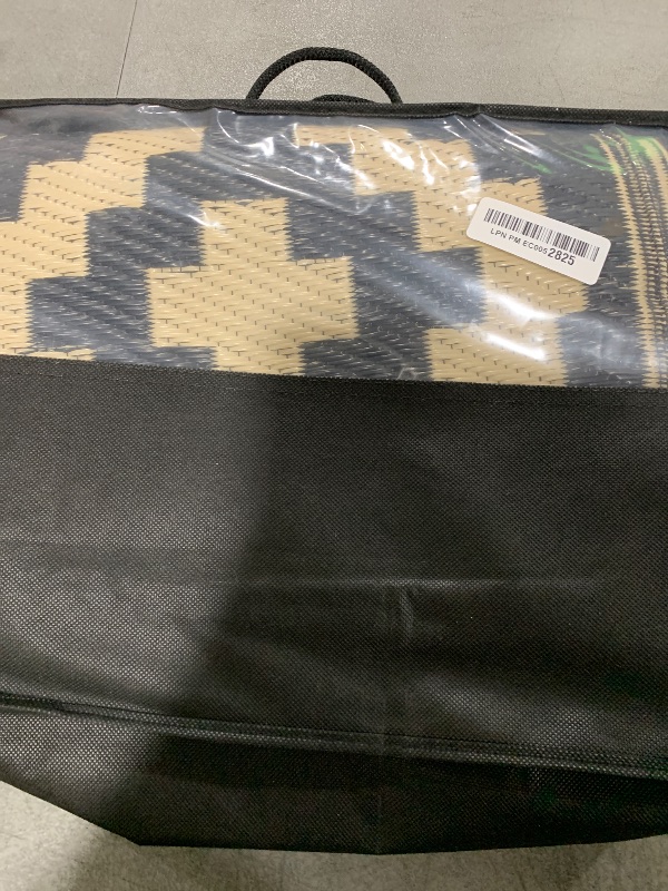 Photo 1 of Smiry Waterproof Outdoor Rug 5x8 ft, Reversible Plastic Straw Patio Camping Rugs, Outdoor Indoor RV Mat Carpet for Patio, Outside Entry, Backyard, Deck, Bench, Picnic, Camper, Black & Beige