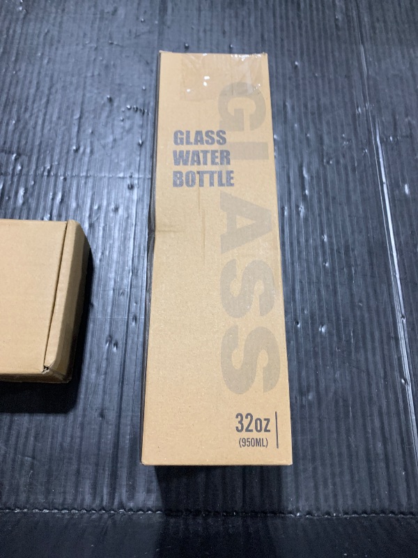 Photo 1 of MUKOKO 32oz Glass Water Bottles with 2 Lids-Handle Spout Lid&Bamboo Straw Lid, Motivational Water Tumbler with Time Marker Reminder and Silicone Sleeve, Leakproof-Black-1 Pack
