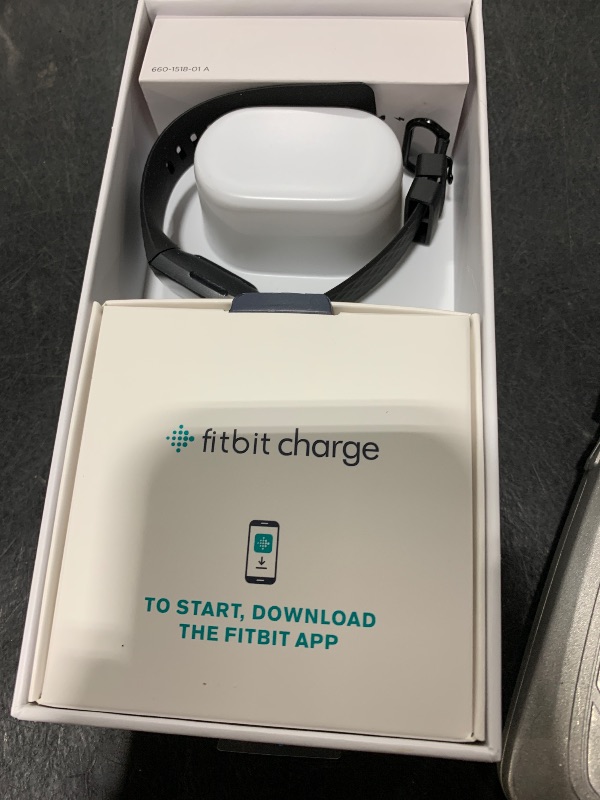 Photo 1 of Fitbit Charge 4 Black Advanced Fitness Tracker